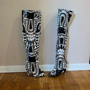 Black and white high thigh boots with low heel
